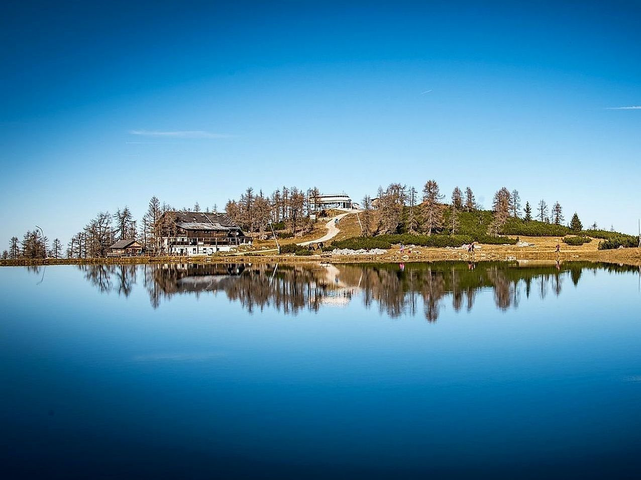 Mountain lake log cabins with boat launches and covered dock spaces for water activities